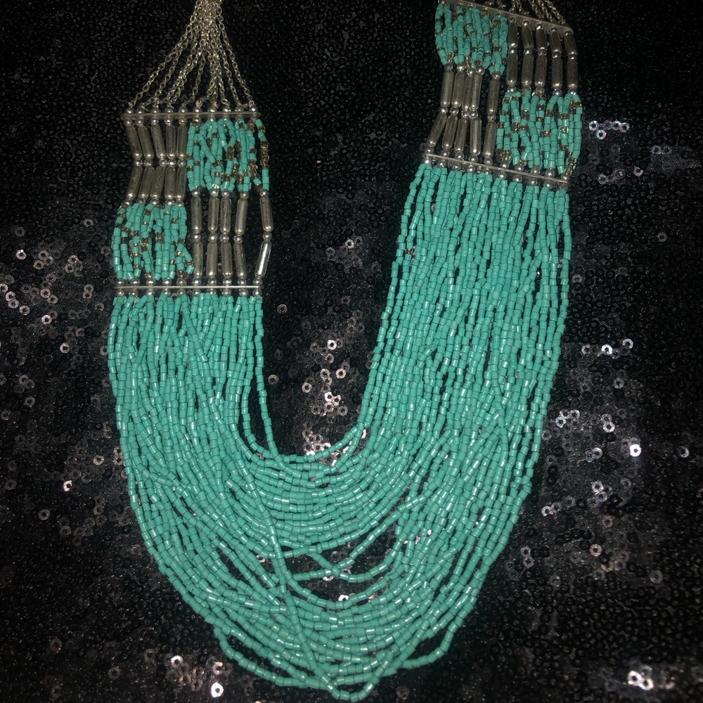 Turquoise & silver beaded necklace.
